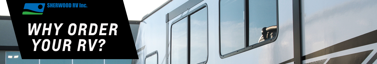 Travel trailer parked in front of Building